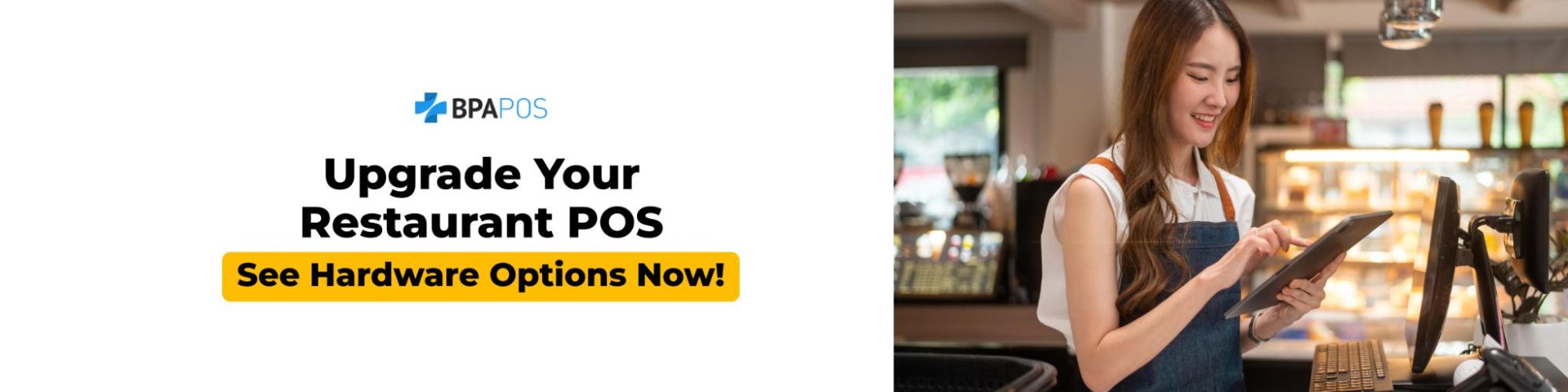 Restaurant staff using a tablet at the counter to manage orders and payments, showcasing modern POS hardware options for faster service and smoother restaurant operations